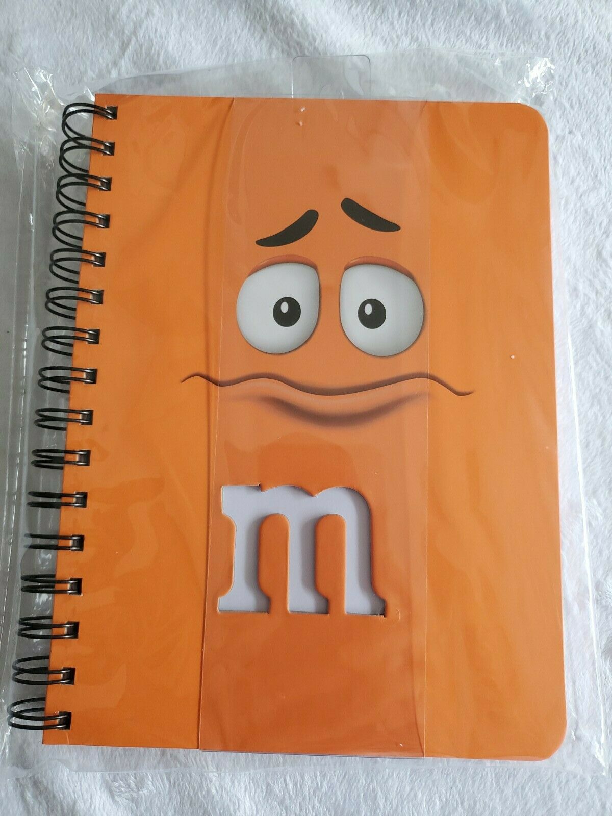 M&M's orange notebook